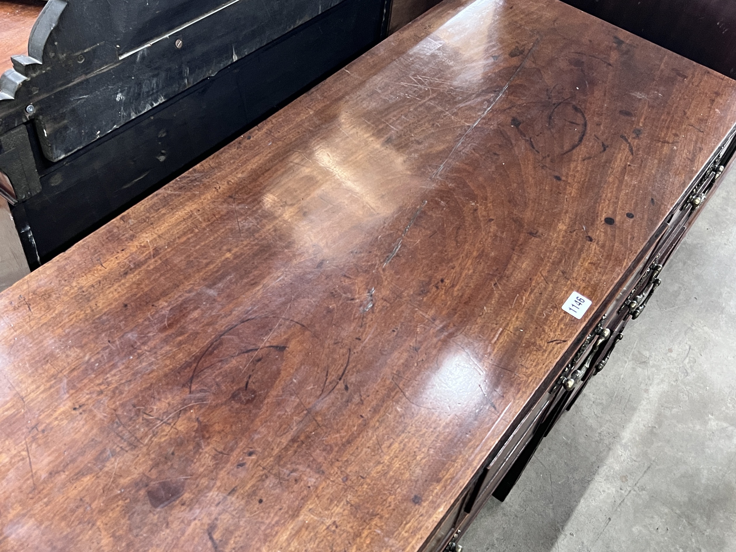 A George III Chippendale style mahogany blind fret kneehole desk, width 112cm, depth 48cm, height 87cm.
